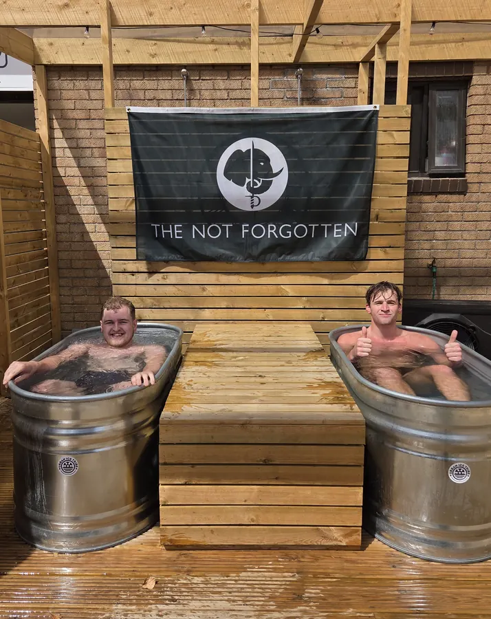 Ice baths in the Recovery and Wellness area beneath The Not Forgotten banner